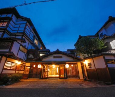 Evening entrance of Seikiro Ryokan with illuminated wooden facade in Kyoto