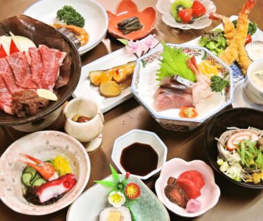 Assorted sashimi, tempura and grilled dishes on table at Sendaiya in Gifu, Chubu