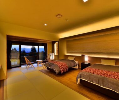 Tatami flooring, twin beds and balcony at Senjukaku in Nagano, Chūbu region