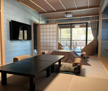 Tatami room with low table, shoji screens and balcony seating at Senkei in Kanagawa, Kantō