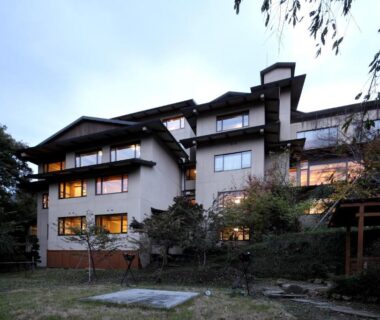 Senkyo Ryokan exterior with lit windows and garden at dusk in Gunma, Kantō