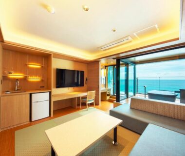 Tatami seating with low table, sofa and balcony bath overlooking sea at Senoumi, Shizuoka, Chūbu