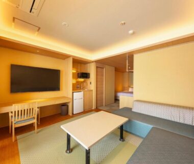 Modern tatami seating area with low table and sofa at Senoumi in Shizuoka, Chūbu, Japan