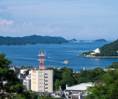 Coastal bay with islands, boats and town rooftops near Senpokaku in Mie prefecture