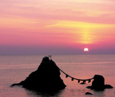 Sunrise over shimenawa-bound coastal rocks, Senpokaku ryokan, Mie, Kansai, Japan