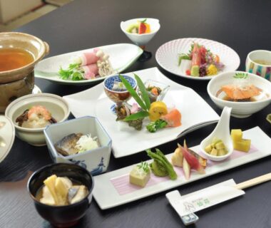 Assorted small dishes and sashimi arranged for a ryokan meal at Senso Yutagawa in Yamagata