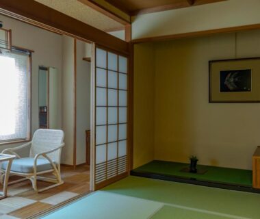 Traditional tatami room with shoji screens, low chairs by window and tokonoma alcove at Sensui in Hyōgo