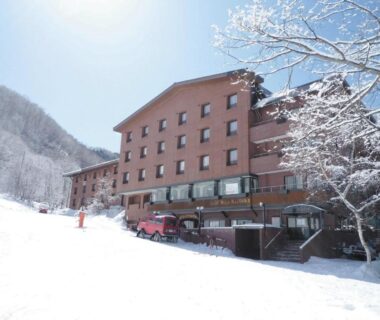 Multi story hotel beside snow covered ski slope at Shiga Kogen Nagano