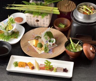 Assorted small Japanese dishes and ceramic pot served at Shiga Park Hotel in Nagano