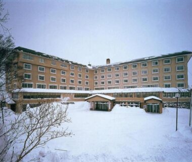 Snow-covered multi-story exterior of Shiga Park Hotel in Nagano, Chubu