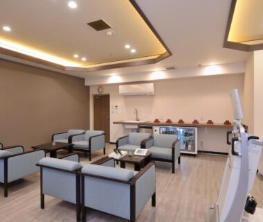 Modern lounge with sofas and low tables at Shiga Park Hotel, Nagano, Chūbu