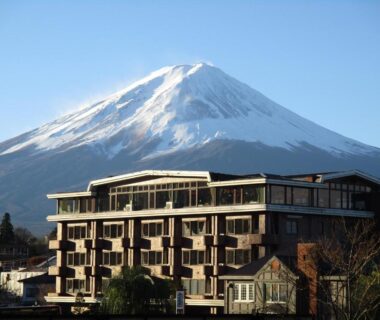 Mount Fuji rising behind the ryokan building Shiki-no-Yado Fujisan in Yamanashi