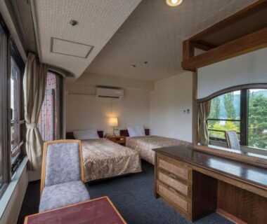 Twin Western-style room with two beds, balcony and mountain view at Shiki-no-Yado Fujisan in Yamanashi