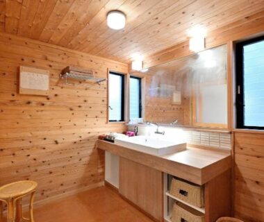 Wooden wash area with sink, mirror and stool at Shikinosato Hanamura, Kumamoto, Kyūshū