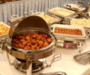 Hot buffet chafing dishes with fried items, sausages and pasta at Shimoda Kaihin Hotel dining area, Shizuoka