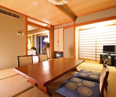 Traditional tatami room with low wooden table, zabuton cushions and shoji screen at Shimoda View Hotel Shizuoka