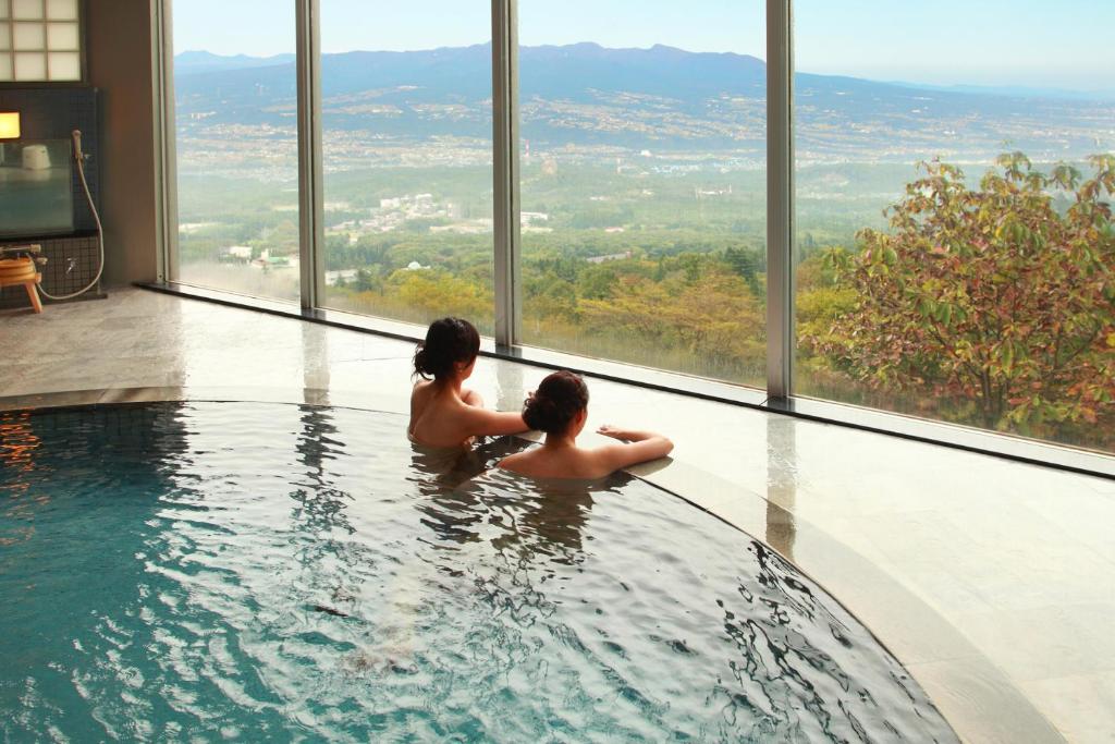 Onsen with Scenic View Shinki Gunma Indoor onsen pool with panoramic windows and valley view at Shinki, Gunma, Kantō