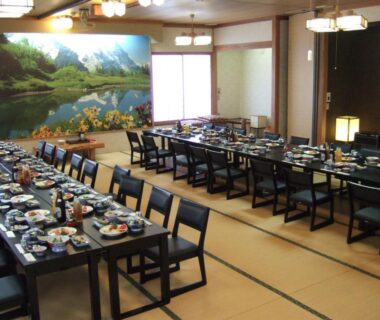 Tatami dining room with set meal trays at Shinseikan in Iwate, Tōhoku