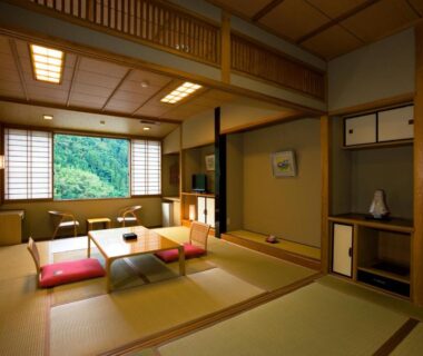 Traditional tatami room with low table and shoji screens at Shinshiyo in Ōita, Kyūshū, Japan