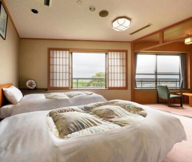 Twin beds, shoji screens and balcony seating at Shintomi-tei in Miyagi Tōhoku