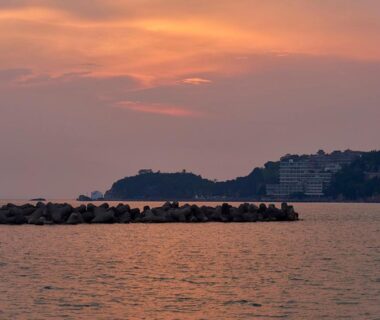 Twilight sea with breakwater and distant shoreline, view from Shinwaka Lodge in Wakayama, Kansai, Japan