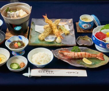 Assorted ryokan meal with tempura, grilled fish, rice, nabe pot and small side dishes at Shinwaka Lodge Wakayama