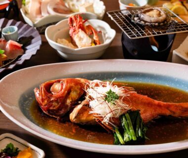 Whole fish in soy-based sauce with assorted side dishes at Shinyu no Yado SAZANA, Shizuoka