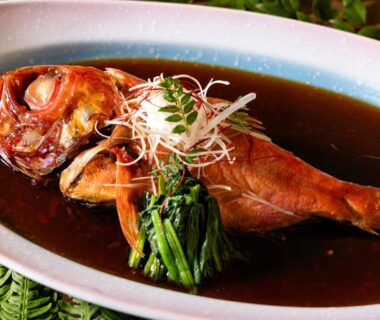 Whole simmered fish in dark broth with greens, served at Shinyu no Yado in Shizuoka, Chūbu Japan