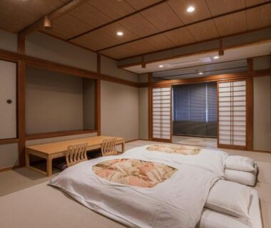 Tatami room with futon bedding and shoji screens at Shinzan Kinosaki in Hyōgo, Kansai
