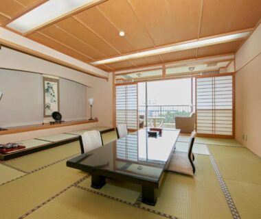 Tatami room with low table and shoji screens at Shirahama Onsen Kisyu Hanto, Wakayama, Japan