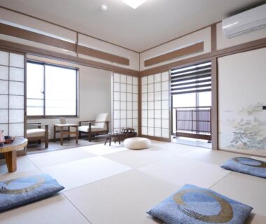 Traditional tatami room with shoji screens, low table and cushions at Shirahama no Yado Daigo in Wakayama