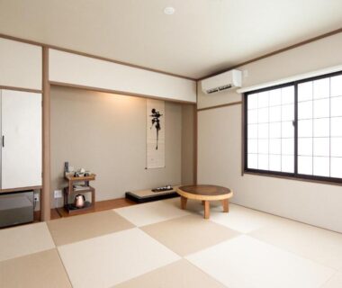 Bright tatami room with low table and shoji screens at Shirahama no Yado Daigo in Wakayama