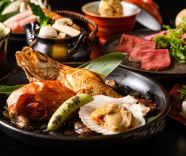 Assorted traditional Japanese dishes on lacquerware at Shirasagiyu Tawaraya, Ishikawa, Chūbu