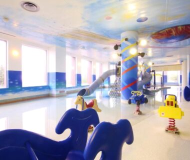Colorful indoor kids' pool with slides at Shiretoko Daiichi Hotel, Hokkaidō Japan