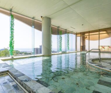 Indoor onsen bath with floor-to-ceiling windows at Shiretoko Daiichi Hotel Hokkaidō Japan