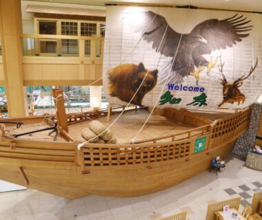 Interior lobby with large wooden ship exhibit and mural at Shiretoko Daiichi Hotel in Hokkaidō