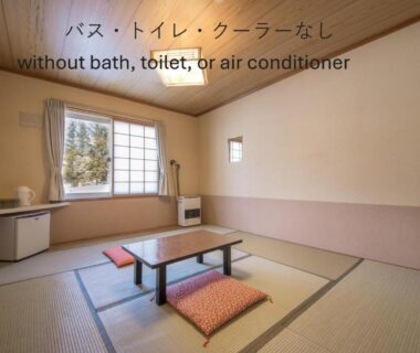 Simple tatami room with low table and cushions, Shiretoko Village Hokkaidō