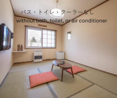 Minimal tatami room with low table and zabuton cushions at Shiretoko Village, Hokkaidō