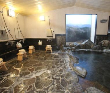 Indoor stone onsen with stools and shower stations at Shitanda, Gifu, Chūbu, Japan