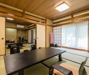 Traditional tatami room with low table and floor chairs, Shiunso ryokan, Kanagawa, Kantō