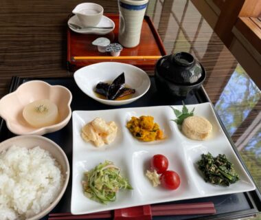 Traditional Japanese breakfast set with rice, side dishes and miso soup on lacquer tray at Shiunso, Tochigi