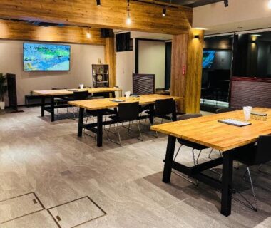 Interior dining area with wooden tables and warm lighting at Shoji Lake Hotel in Yamanashi, Chūbu, Japan
