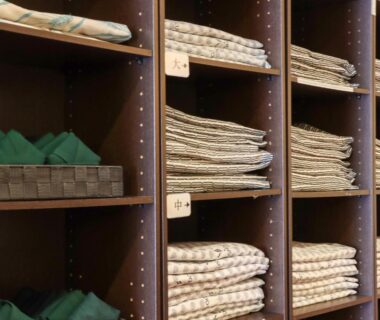 Stacked yukata and towels on shelves at Shugyoku no Yu Yakushido Onsen in Iwate, Tōhoku