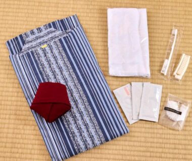 Striped yukata, towel and disposable toiletries arranged on tatami at Shuzenji Onsen Hotel Takitei, Shizuoka