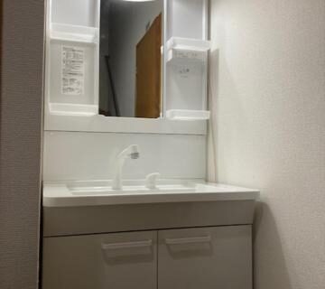 Compact white sink with illuminated mirror at Sky Tree INN Ⅱ Tokyo