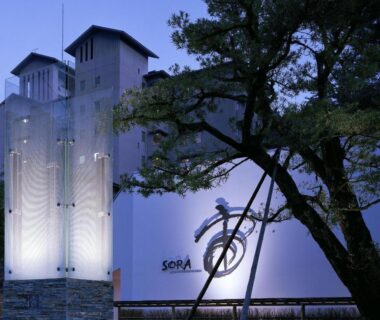 Illuminated Sora Togetsusoukinryu exterior with entrance tree at dusk, Shizuoka, Chūbu, Japan