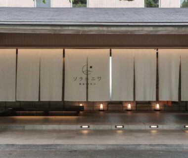 Noren curtains over lit steps at Soratoniwa Atami Izusan entrance, Shizuoka, Chubu, Japan