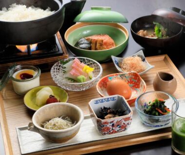 Japanese breakfast tray with rice pot, assorted side dishes and green tea at Soratoniwa Atami Izusan, Shizuoka