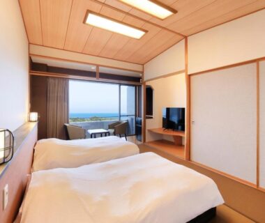 Western style twin beds, shoji screens, balcony with distant sea view at Soratoniwa Atami Izusan, Shizuoka