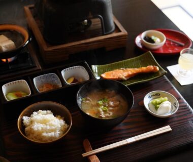 Grilled fish, rice, miso soup and small side dishes on tray at Soumeian ryokan, Gunma